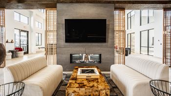 Club Room With Large Screen Tvs And A Fireplace at Nuvo Flats, Indiana
